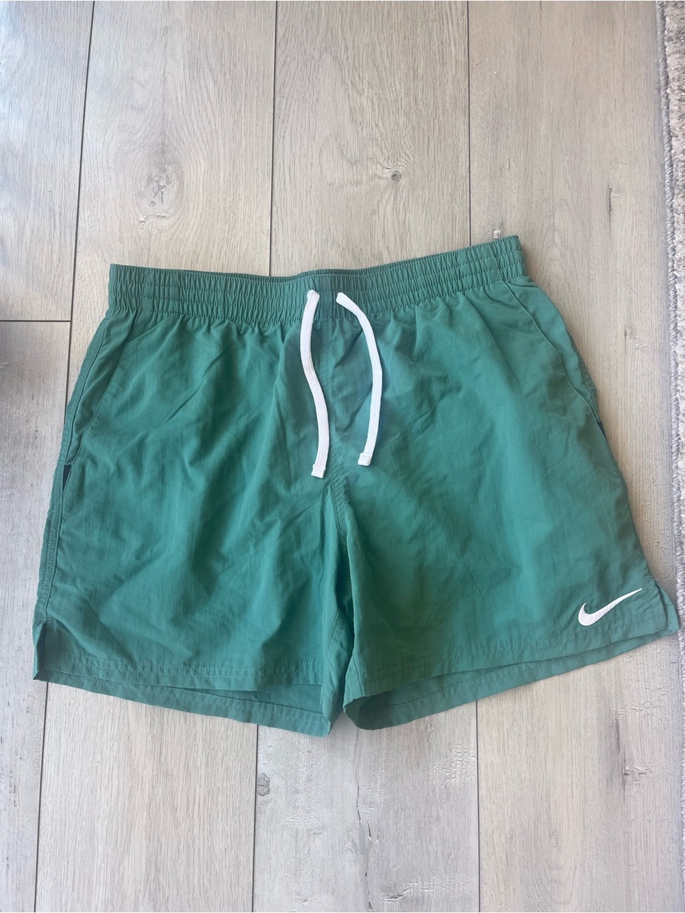 Nike Teal Athletic Shorts with White Swoosh
